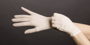 Female hands in latex gloves